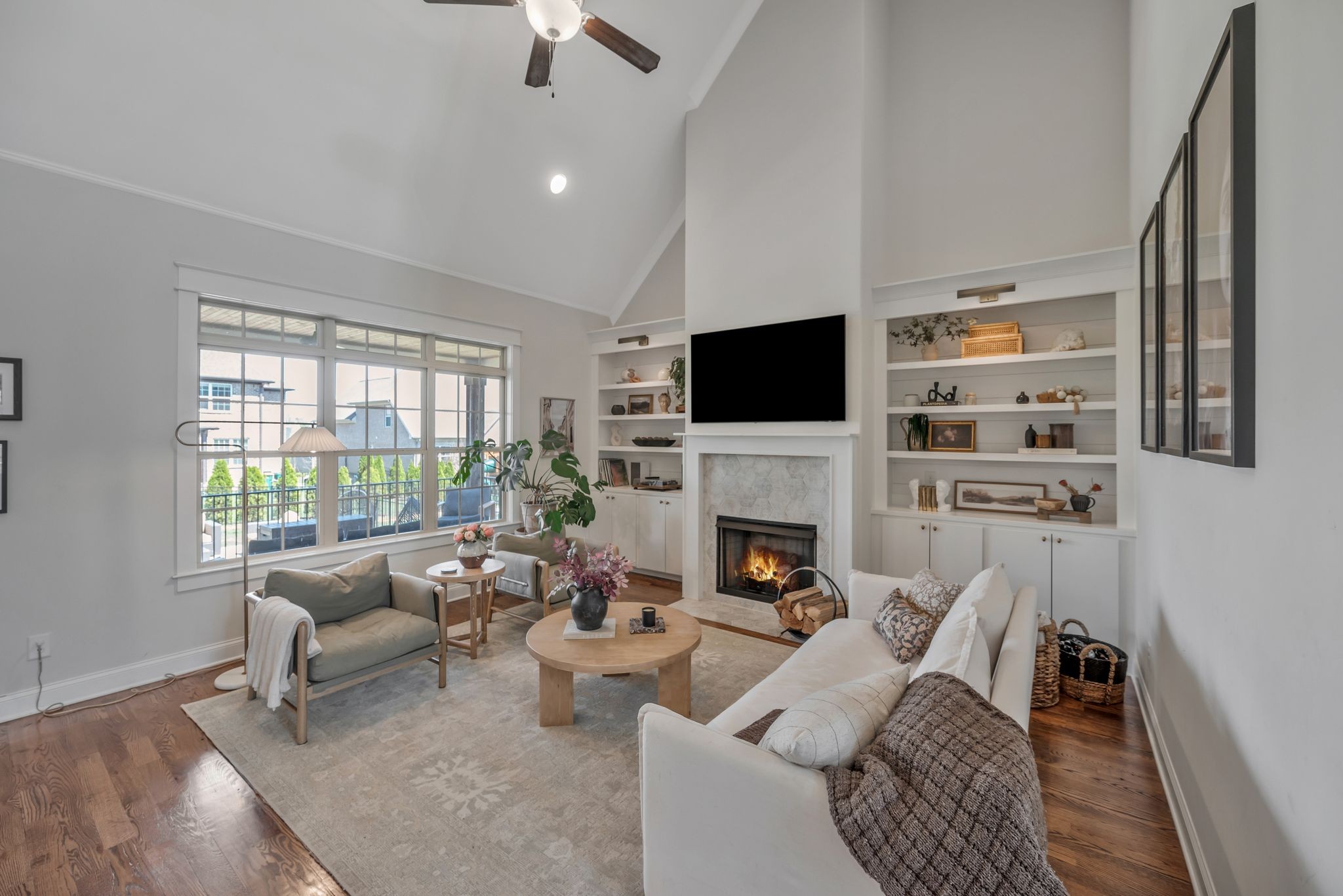 1009 Alpaca Drive Spring Hill, TN 37174 - Photo 27 of 48 a living room with furniture a fireplace and a flat screen tv