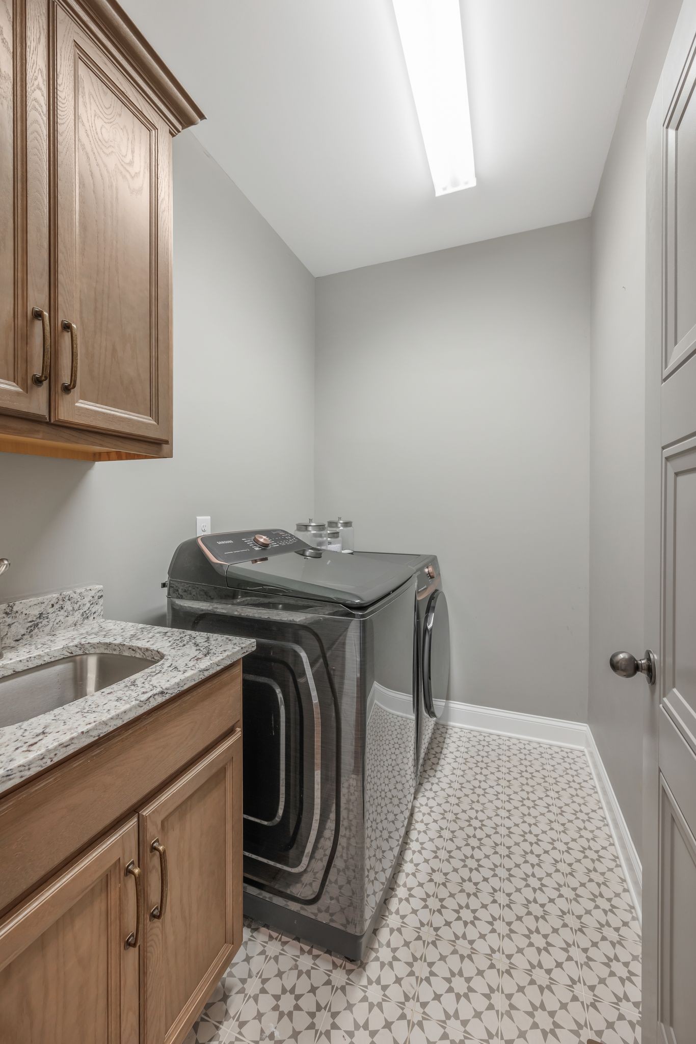 1009 Alpaca Drive Spring Hill, TN 37174 - Photo 28 of 48 a utility room with sink dryer and washer