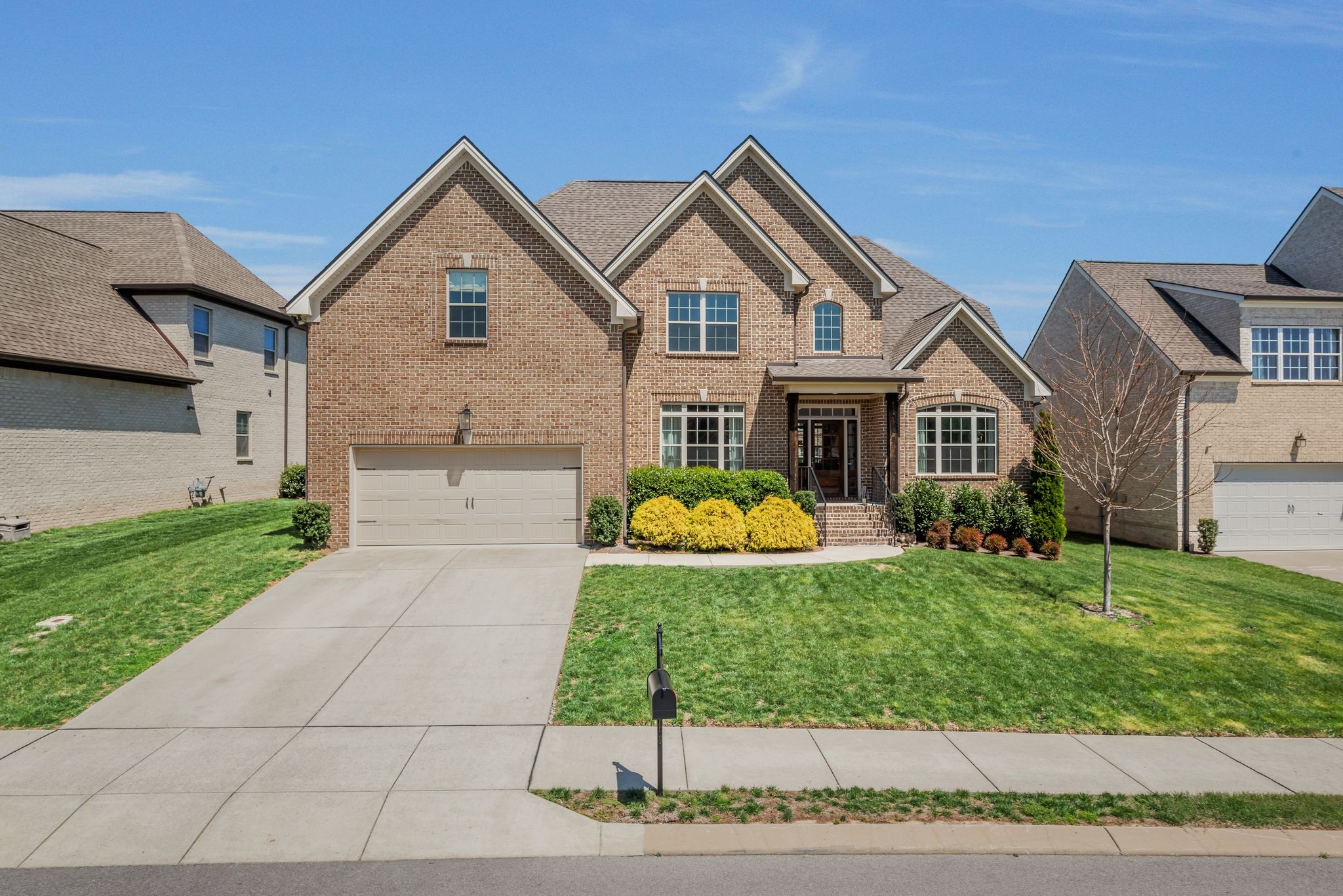 1009 Alpaca Drive Spring Hill, TN 37174 - Photo 3 of 48 a front view of house with yard and green space