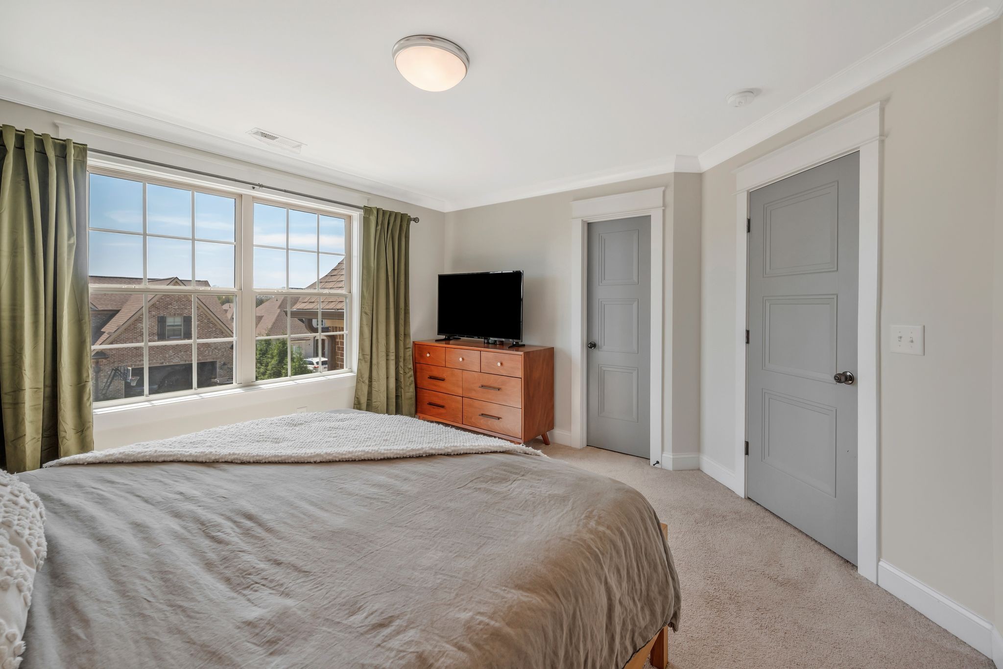 1009 Alpaca Drive Spring Hill, TN 37174 - Photo 40 of 48 a large bedroom with a bed and a flat tv screen in it