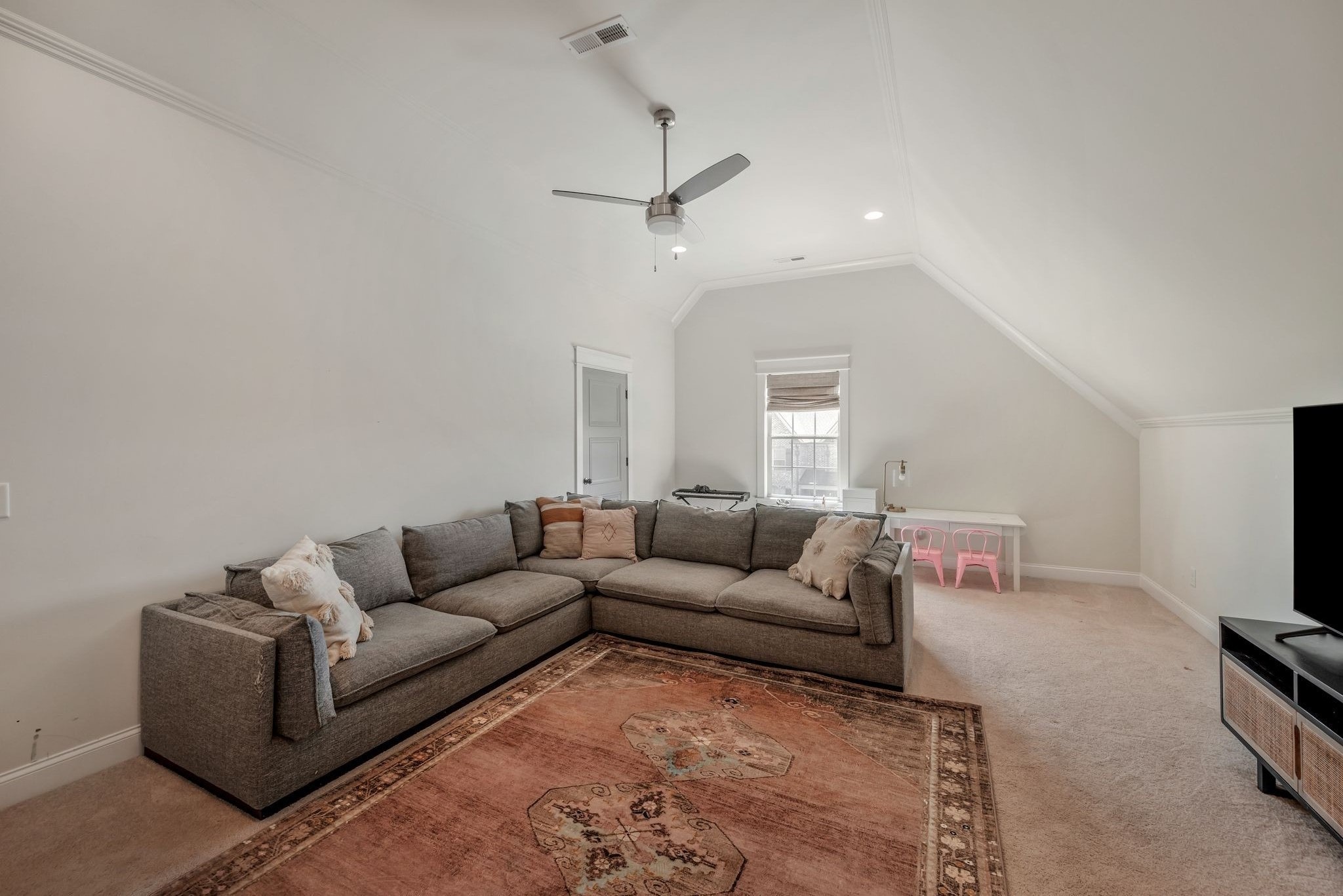 1009 Alpaca Drive Spring Hill, TN 37174 - Photo 41 of 48 a living room with furniture and a flat screen tv