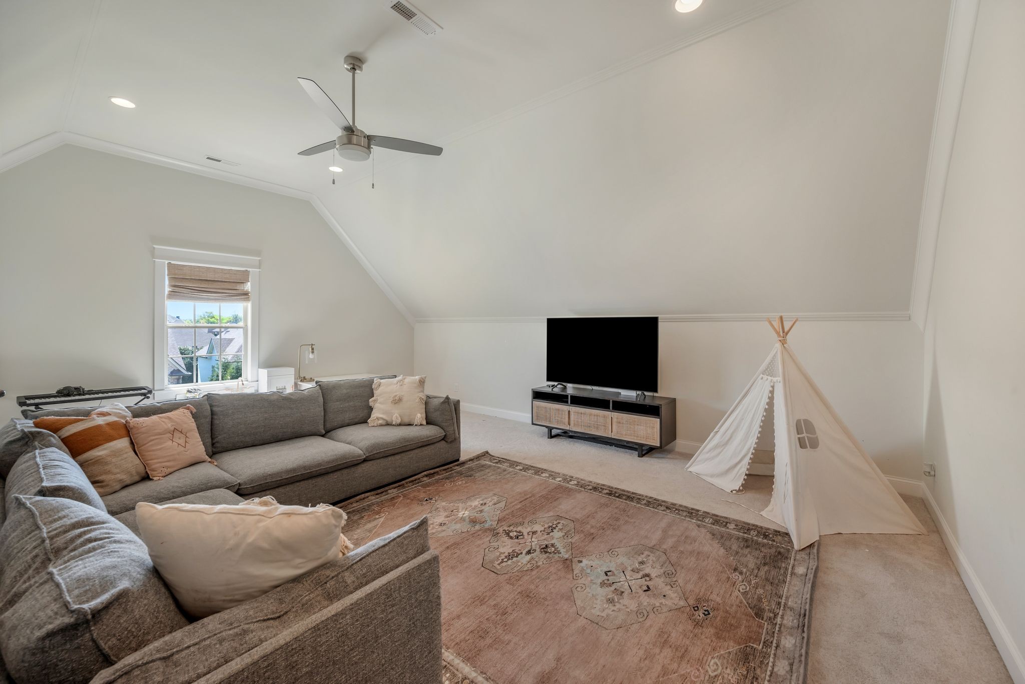 1009 Alpaca Drive Spring Hill, TN 37174 - Photo 42 of 48 a living room with furniture and a flat screen tv