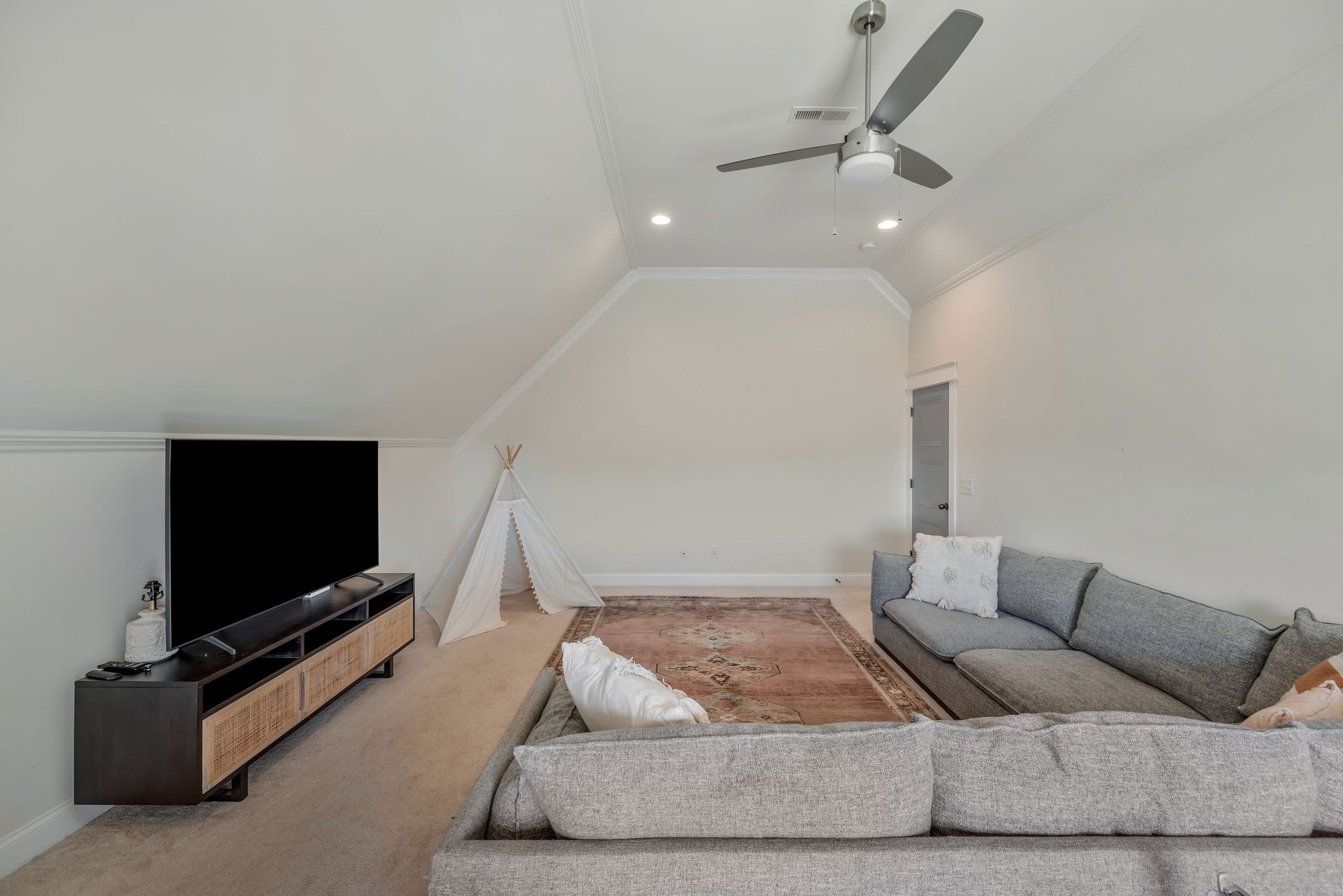 1009 Alpaca Drive Spring Hill, TN 37174 - Photo 43 of 48 a living room with furniture and a flat screen tv