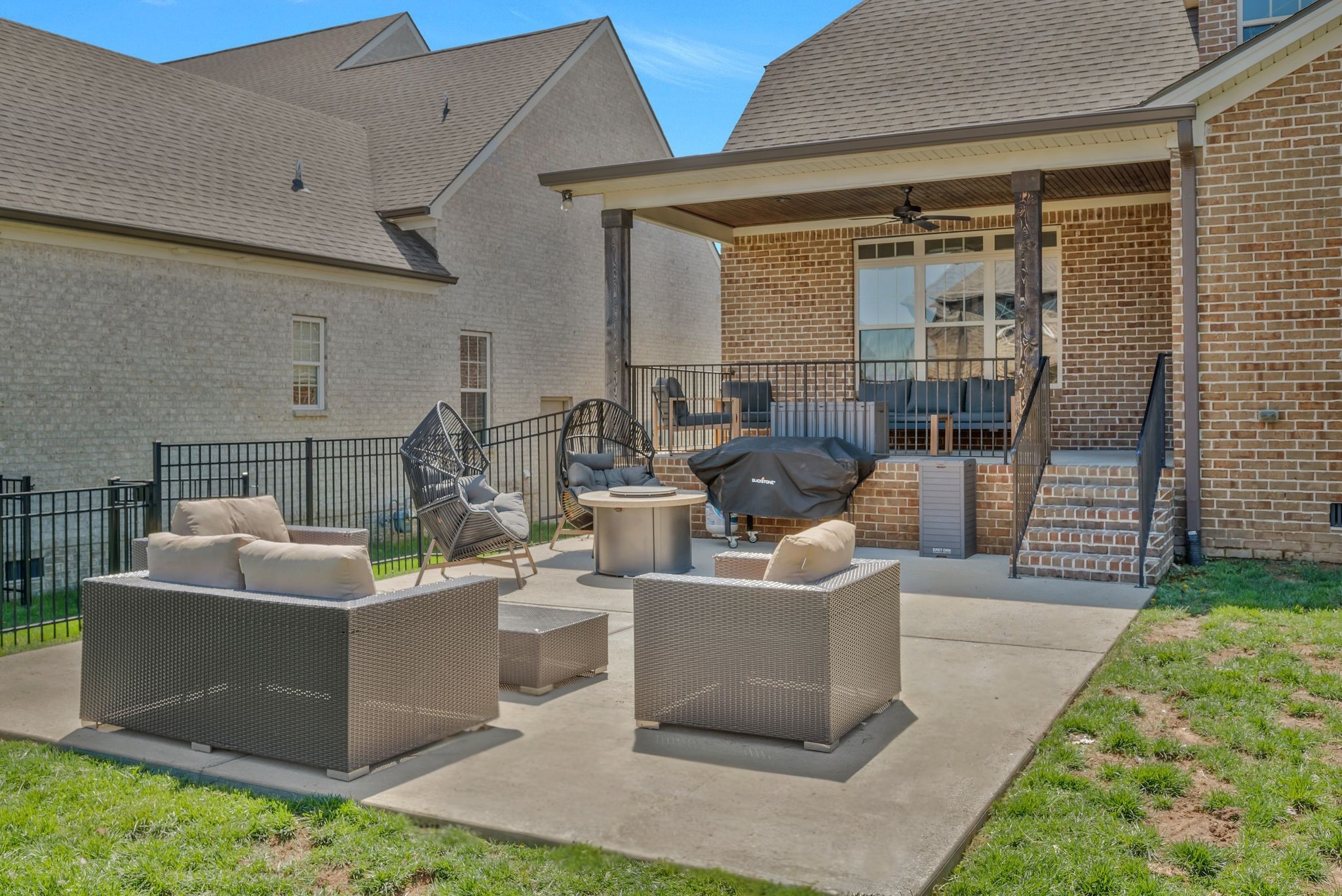 1009 Alpaca Drive Spring Hill, TN 37174 - Photo 46 of 48 a view of a patio with couches chairs and a yard