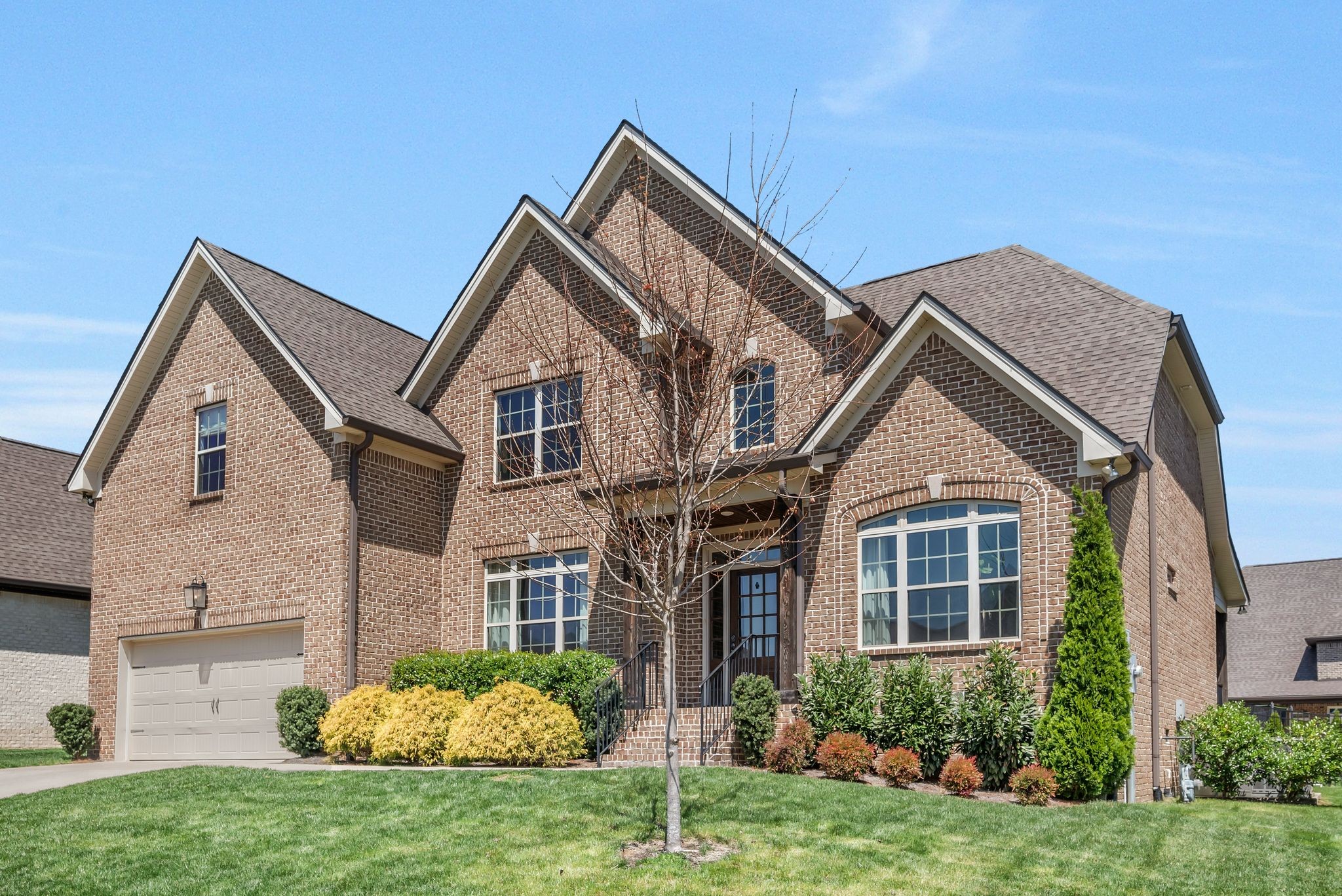 1009 Alpaca Drive Spring Hill, TN 37174 - Photo 5 of 48 a front view of a house with a yard