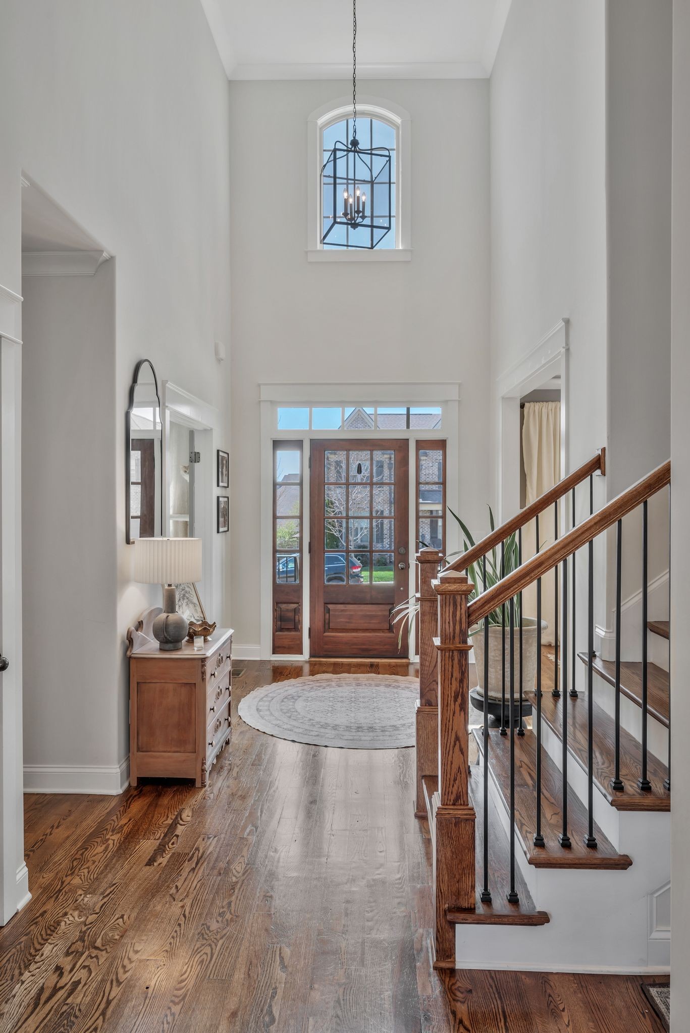 1009 Alpaca Drive Spring Hill, TN 37174 - Photo 10 of 48 a living room with stairs and a couch