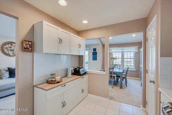 a kitchen with a cabinets and chairs