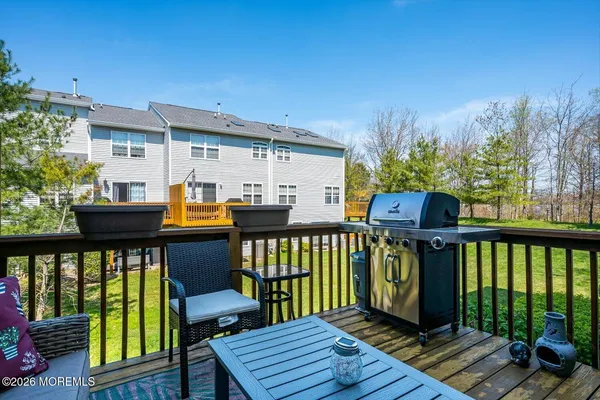 a view of a chairs and table on the deck