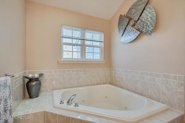 a bath tub sitting next to a window