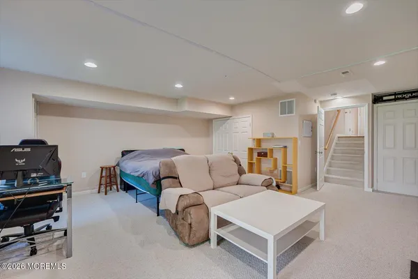 a room with a bed and a chair