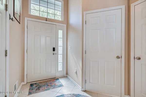 a view of an entryway with wooden floor