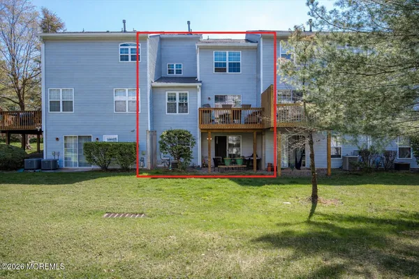 a view of a building with a yard