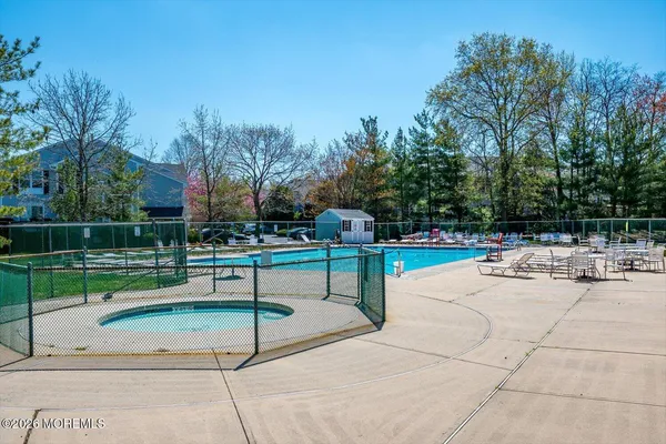 a front view of house with yard and outdoor seating