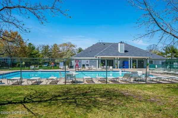 a view of a swimming pool with a yard