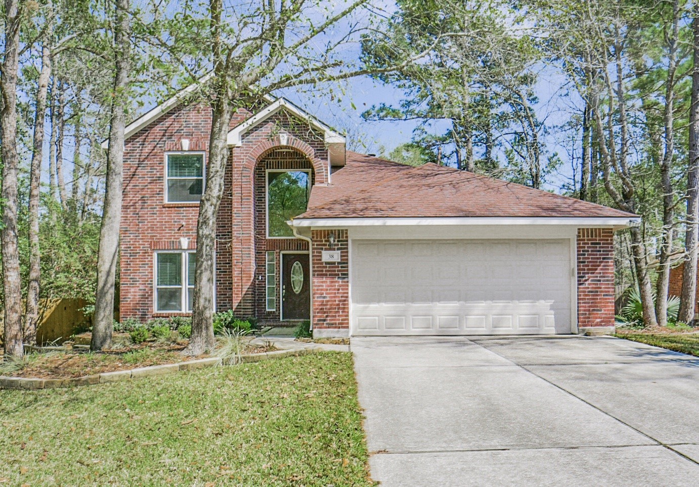 38 Tallow Hill Place Spring, TX 77382 - Photo 1 of 50 a front view of a house with garden