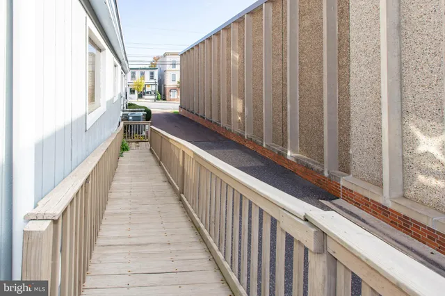 a view of a balcony with wooden floor