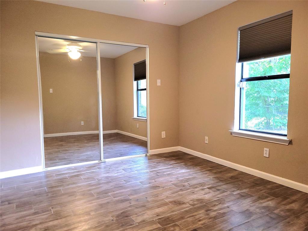 912 North Dove Road Grapevine, TX 76051 - Photo 18 of 36 an empty room with wooden floor and entrance