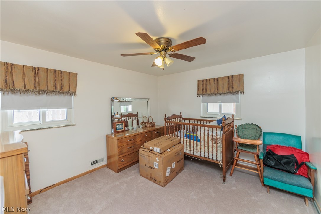 6147 Holburn Road Cleveland, OH 44129 - Photo 13 of 45 Bedroom with carpet floors and ceiling fan
