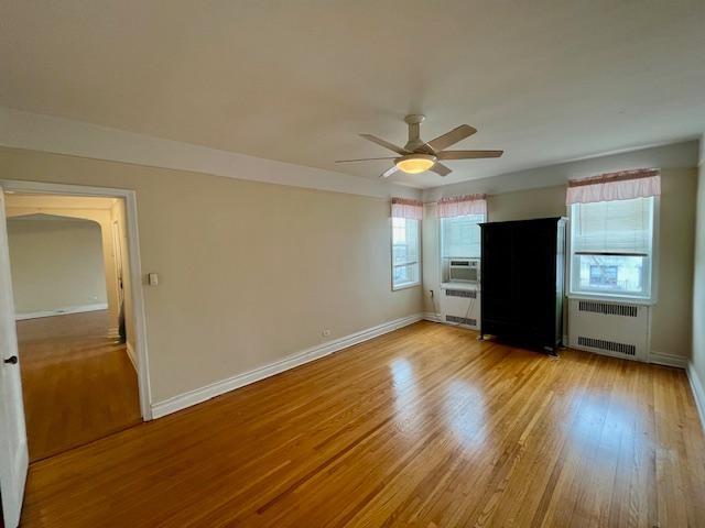 243 78th Street, Unit 6H Brooklyn, NY 11209 - Photo 12 of 19 a view of an empty room with a window and wooden floor