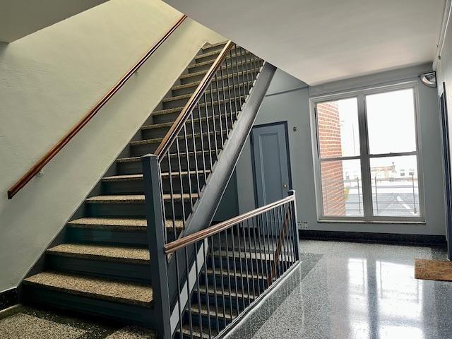 243 78th Street, Unit 6H Brooklyn, NY 11209 - Photo 15 of 19 a view of staircase with wooden floor and white walls