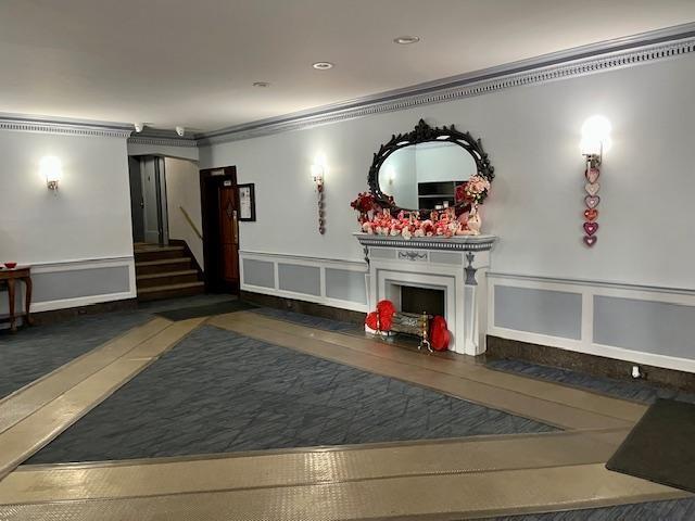 243 78th Street, Unit 6H Brooklyn, NY 11209 - Photo 3 of 19 a view of a livingroom with furniture staircase and a fireplace