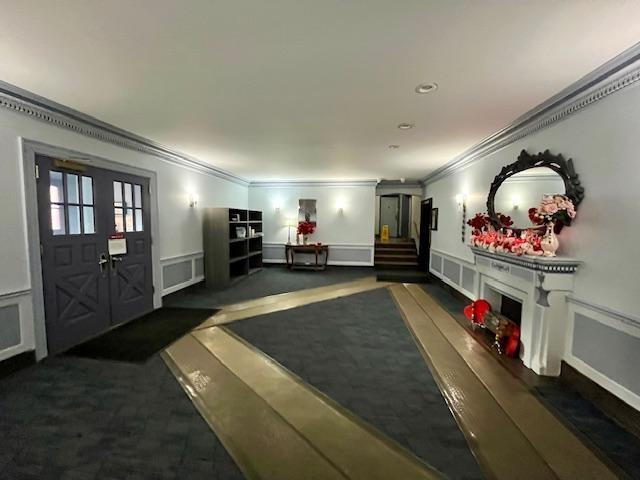 243 78th Street, Unit 6H Brooklyn, NY 11209 - Photo 5 of 19 a living room with furniture and a flat screen tv