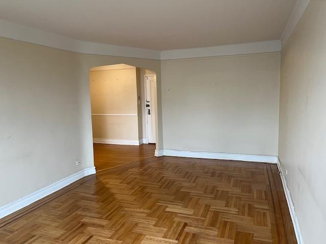 243 78th Street, Unit 6H Brooklyn, NY 11209 - Photo 8 of 19 wooden floor in an empty room with a window