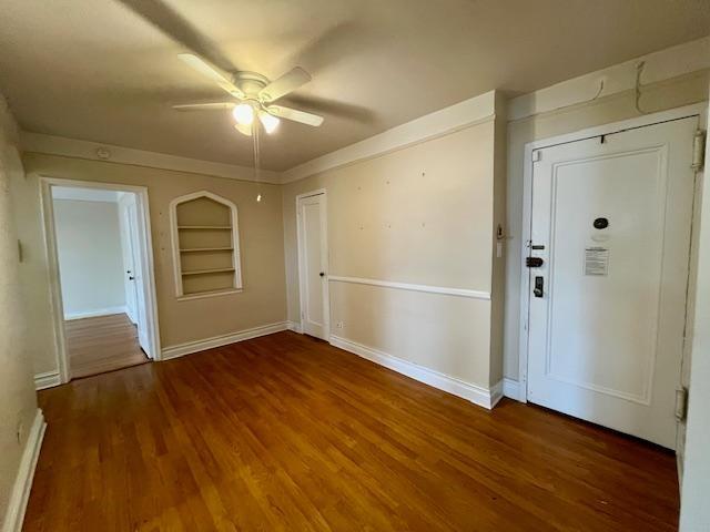 243 78th Street, Unit 6H Brooklyn, NY 11209 - Photo 10 of 19 an empty room with wooden floor and a ceiling fan