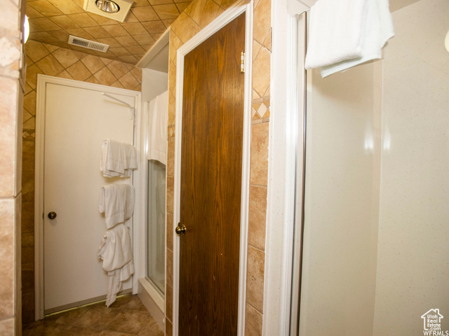 588 Raspberry Patch Road Garden City, UT 84028 - Photo 40 of 74 Bathroom featuring a stall shower and tile patterned floors