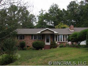263 Docks Road Hendersonville, NC 28792 - Photo 1 of 12 a front view of a house with a yard