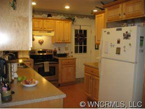 263 Docks Road Hendersonville, NC 28792 - Photo 2 of 12 a kitchen with refrigerator and window