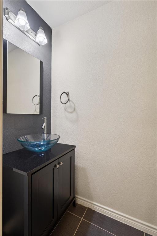 7308 Hawk Lane Sachse, TX 75048 - Photo 20 of 37 a bathroom with a sink and a mirror