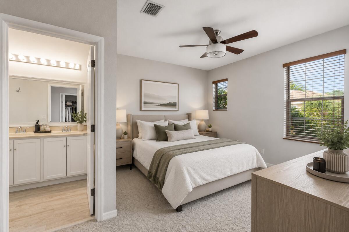 468 Francesca Ridge Road Boynton Beach, FL 33435 - Photo 10 of 11 a bedroom with a bed and a table