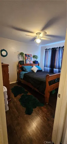 a bedroom with furniture and a book shelf