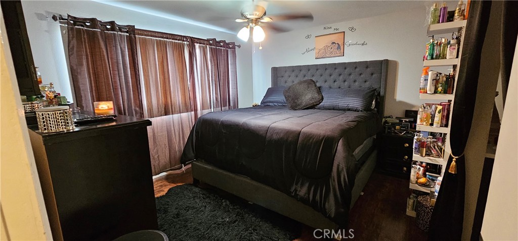 5535 Ackerfield Avenue, Unit 9 Long Beach, CA 90805 - Photo 13 of 19 a bedroom with a bed and a mirror