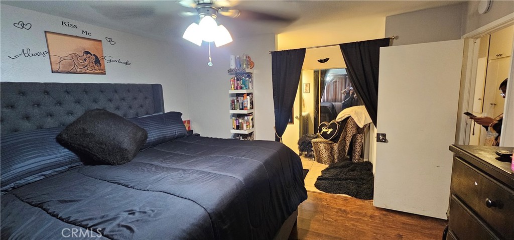 5535 Ackerfield Avenue, Unit 9 Long Beach, CA 90805 - Photo 14 of 19 a bedroom with a bed and a flat screen tv