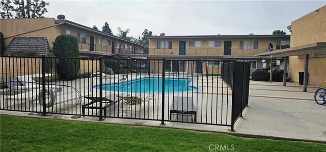 a view of a pathway both side of house