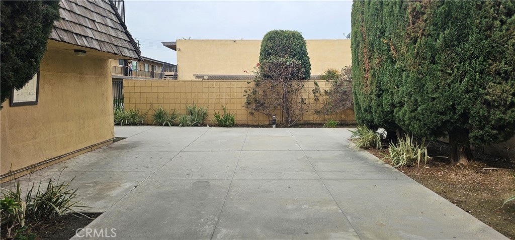 5535 Ackerfield Avenue, Unit 9 Long Beach, CA 90805 - Photo 19 of 19 a view of a pathway both side of house