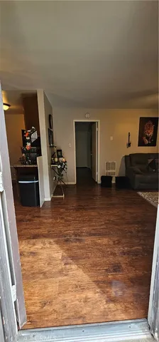 a view of a livingroom with wooden floor