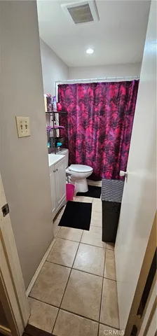 a view of a refrigerator with wooden floor
