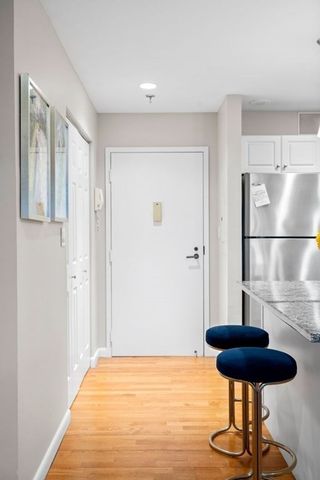 a view of empty room with a sink and a rug