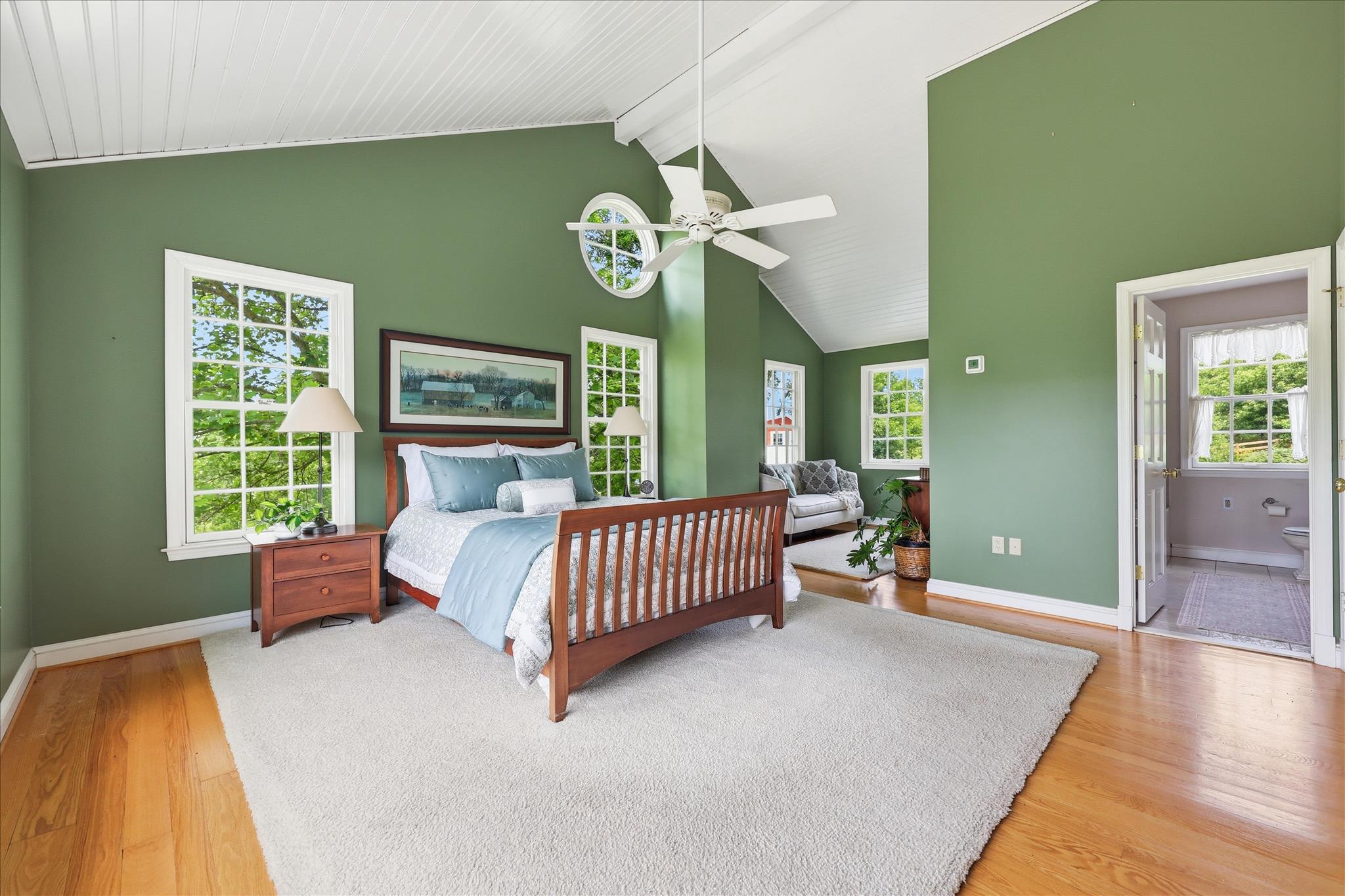 10919 Etzler Mill Road Woodsboro, MD 21798 - Photo 22 of 54 a spacious bedroom with a bed and a chandelier