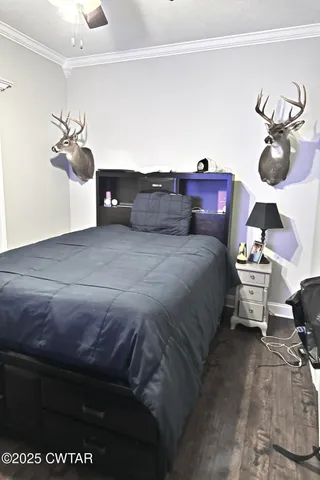 a bedroom with a bed and cabinets