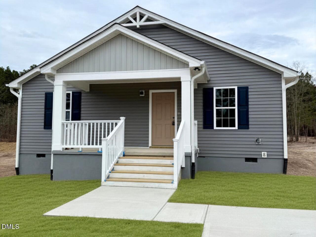 a view of a house with a small yard