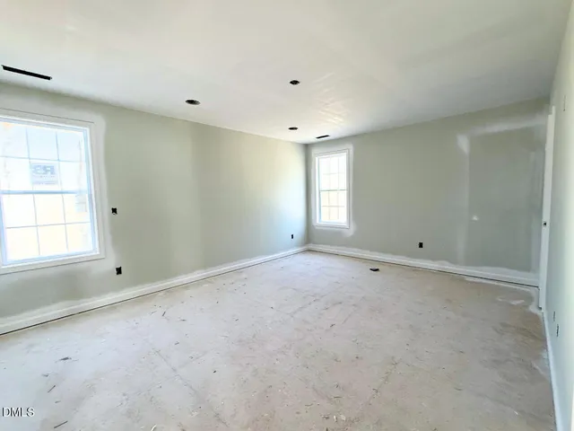 a room with a table and a rug