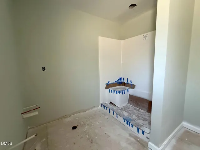 a backyard of a house with wooden fence