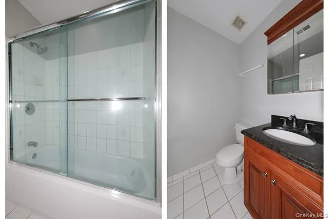 a bathroom with a granite countertop sink a toilet and shower