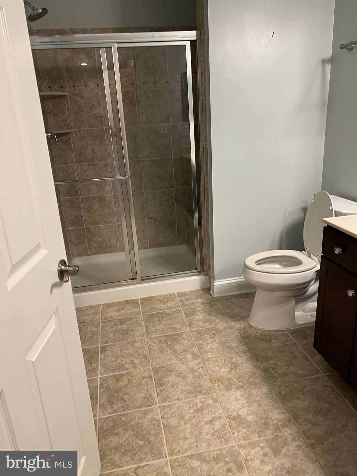 3910 Doc Berlin Drive, Unit 14 Silver Spring, MD 20906 - Photo 11 of 13 a bathroom with a shower and a toilet