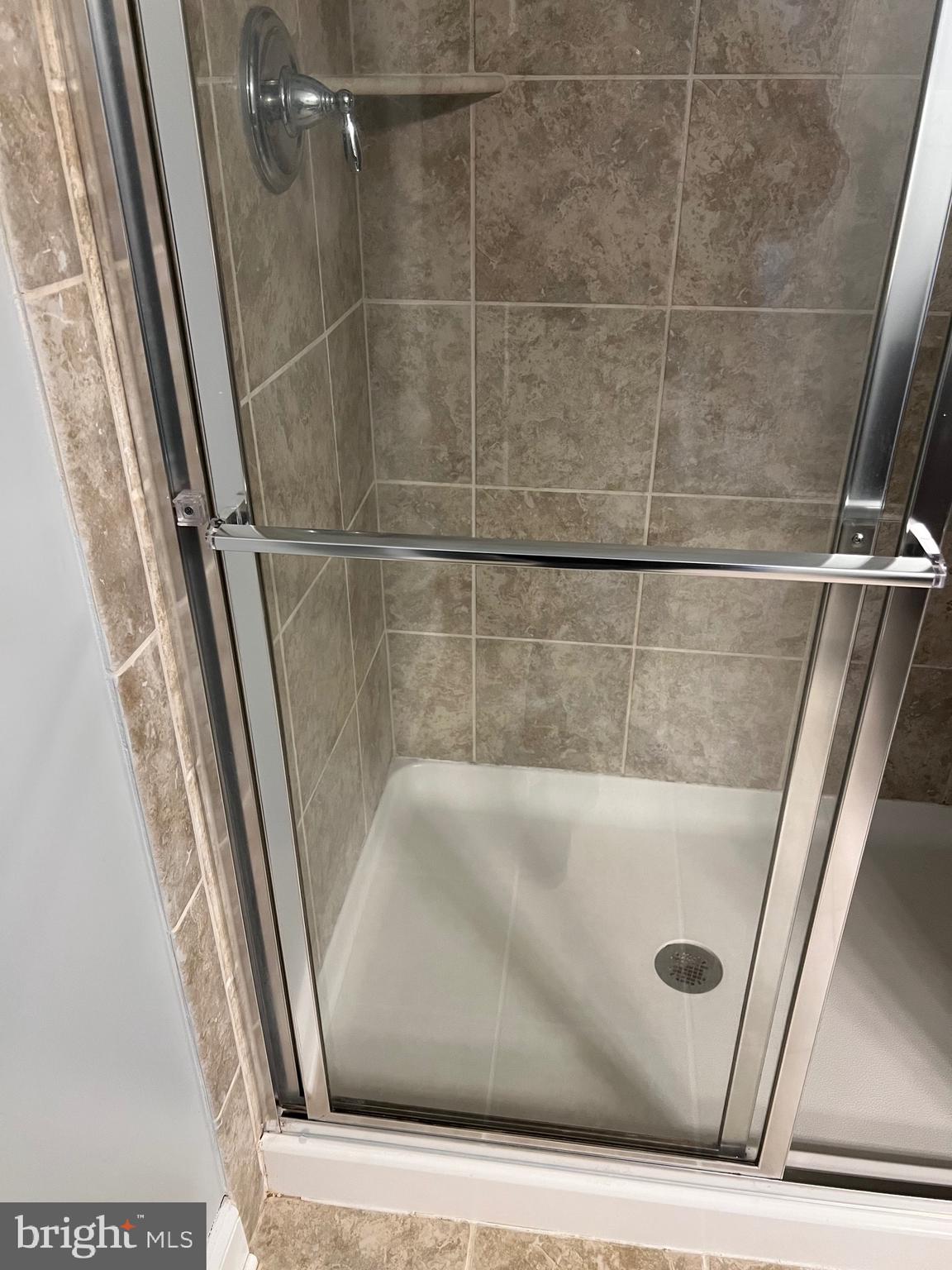 3910 Doc Berlin Drive, Unit 14 Silver Spring, MD 20906 - Photo 6 of 13 a bathroom with a shower