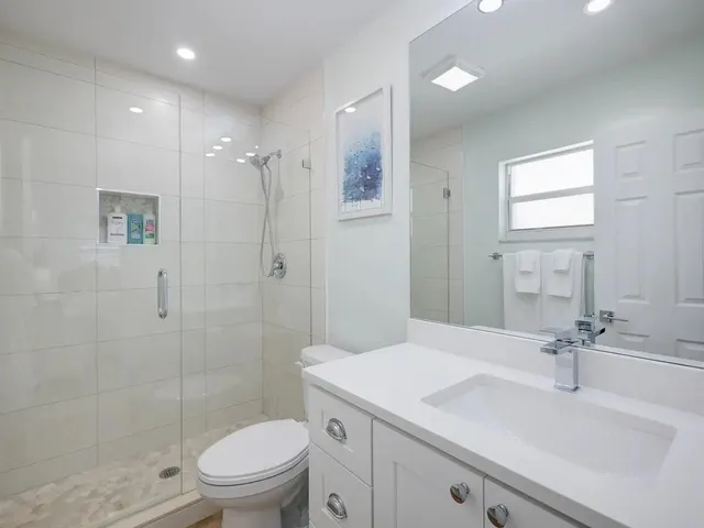 a view of a house with swimming pool in front of it